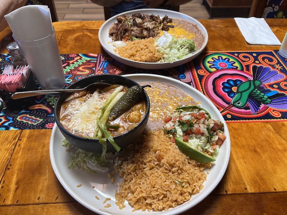 Colorful Mexican dishes on a restaurant table.