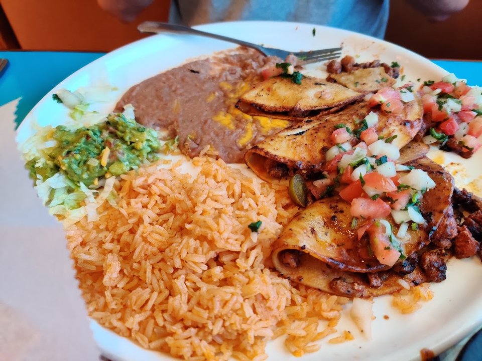 Printed menu with fajitas and seafood options.