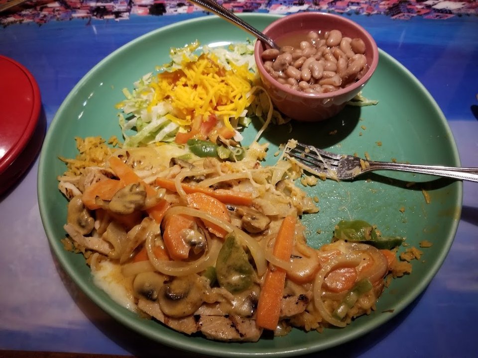 Printed menu with fajitas and seafood options.