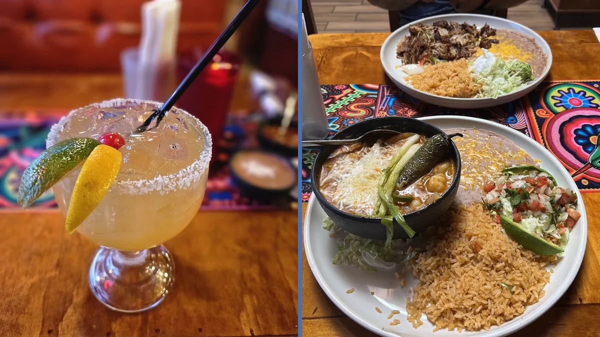 Plates of fajitas and soup on a table.