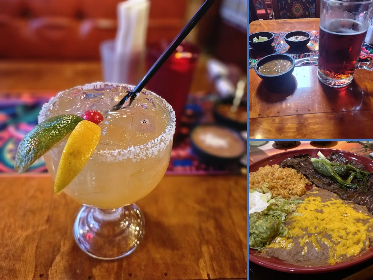 Plates of fajitas and soup on a table.